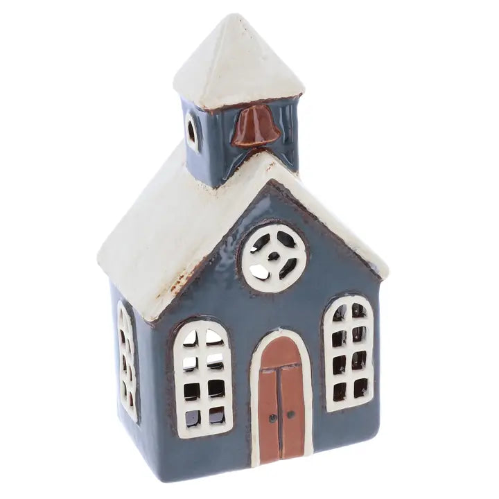 Small ceramic church  tealight holder with a bell tower on a white background
