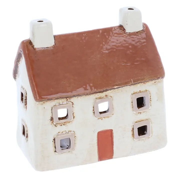 Ceramic house-shaped tealight holder with a brown roof on a white background