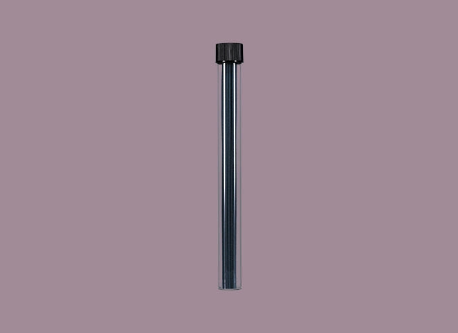 Incense sticks in a container on a purple background