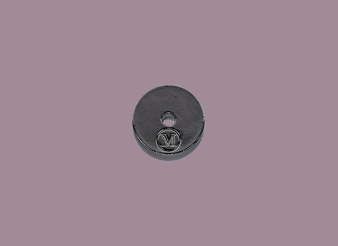 Round incense holder with a logo on a gray background