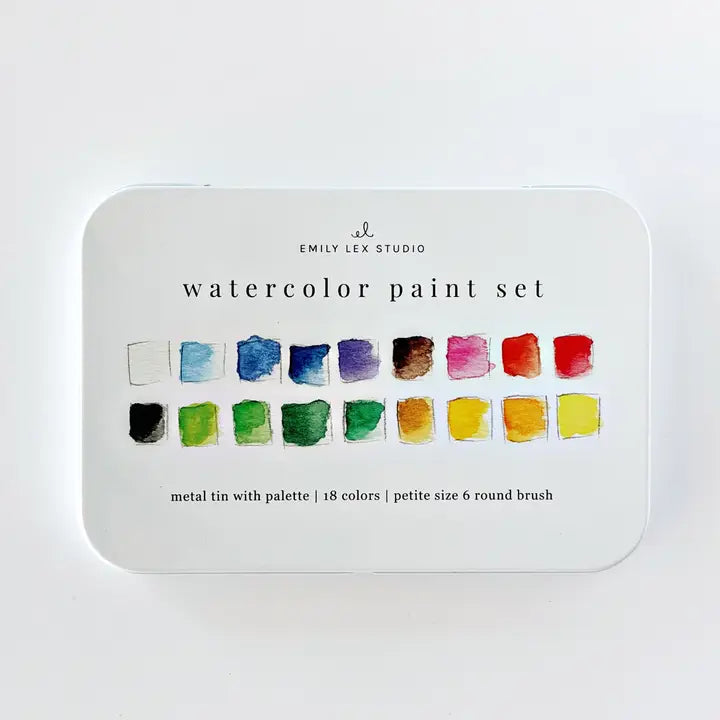 A metal tin watercolor paint set by Emily Lex Studio, featuring 18 watercolor swatches in various colors on a white background.