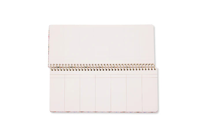 Opened weekly ringbound planner on a white background