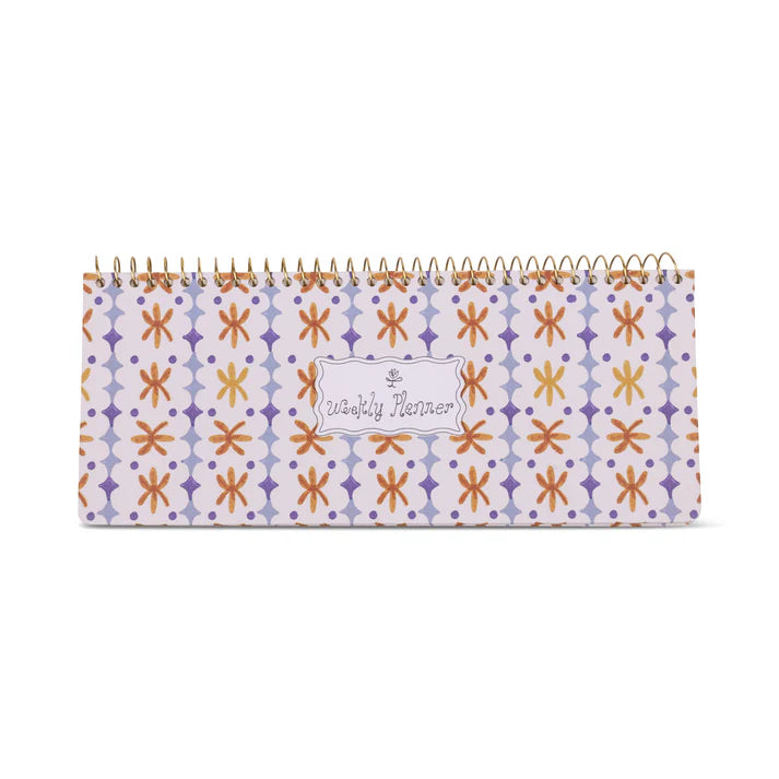 Patterned planner with spiral binding on a white background