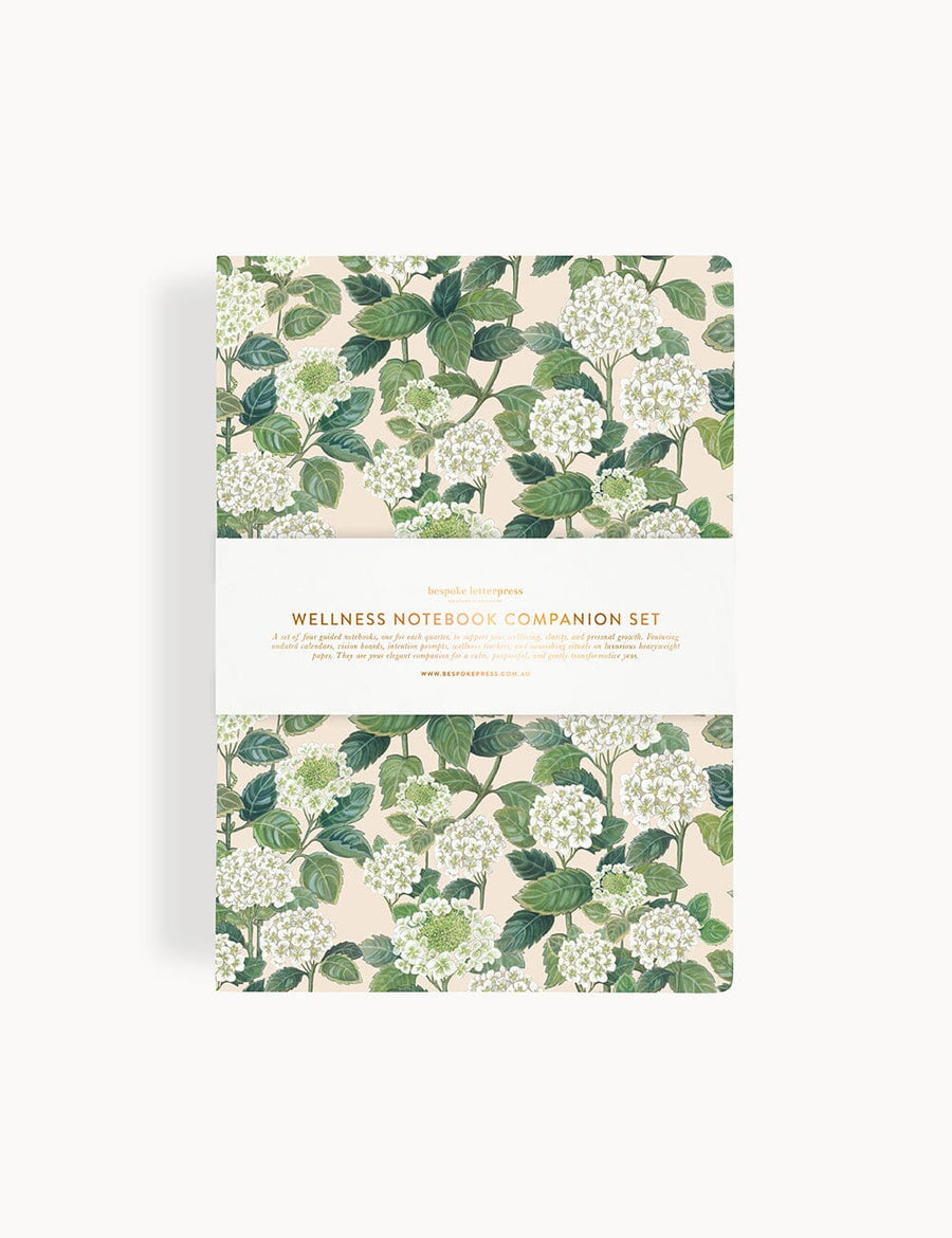 Wellness notebook and companion set with floral design on a white background