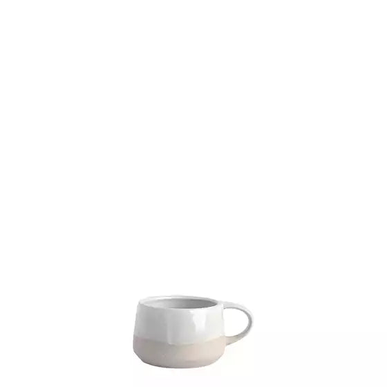 White ceramic mug on a white background