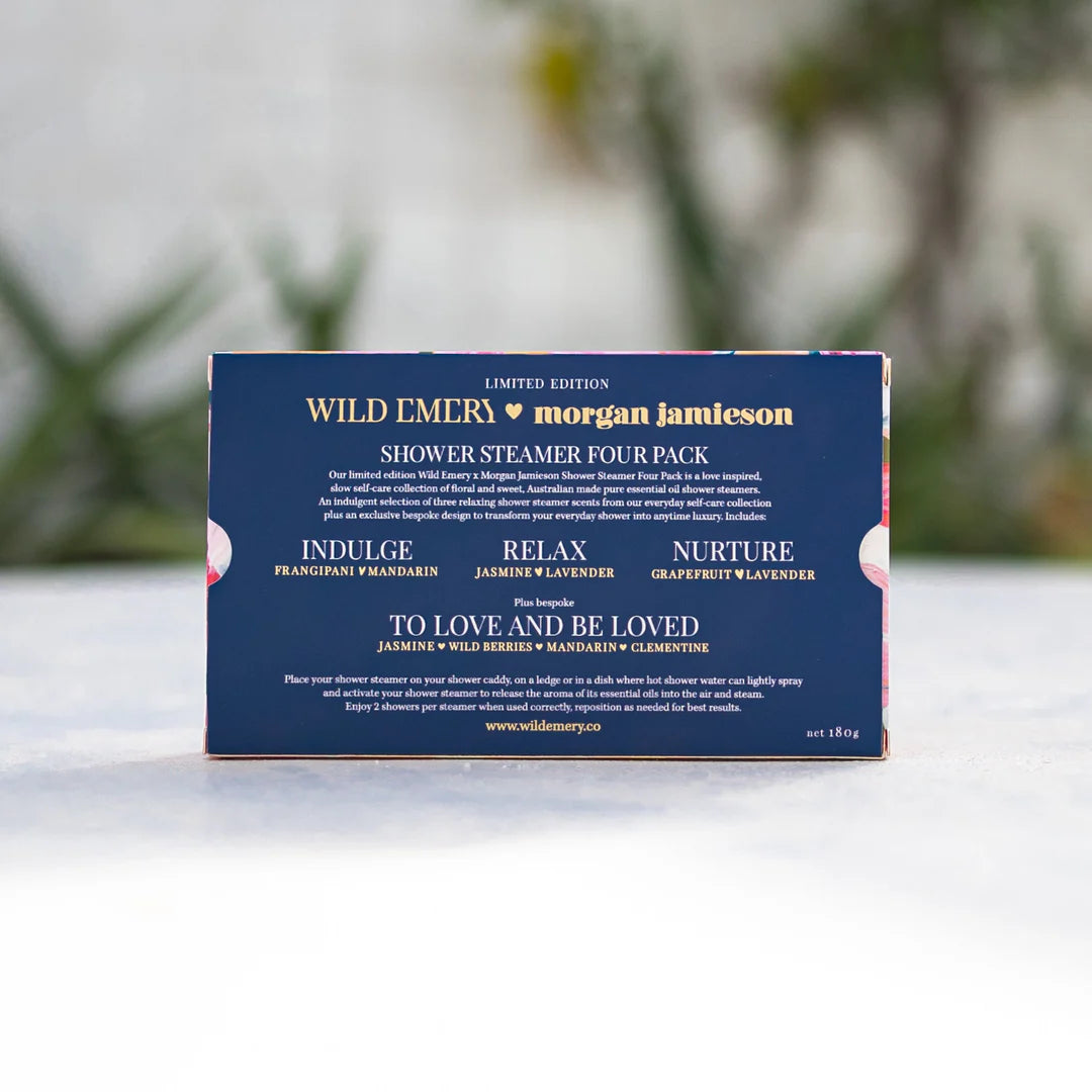Box of Wild Emery &amp; Morgan Jamieson shower steamers on a white surface with a blurred natural background