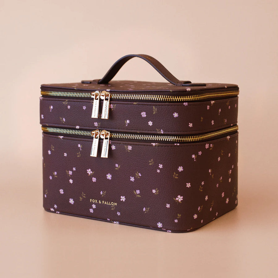 Makeup vanity case with floral pattern on a beige background