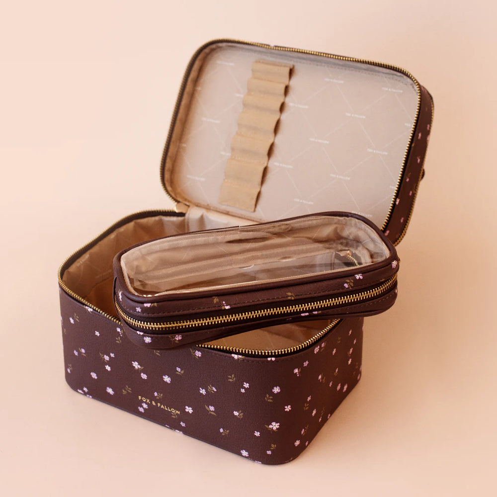 Brown & floral vanity case with floral pattern on a beige background