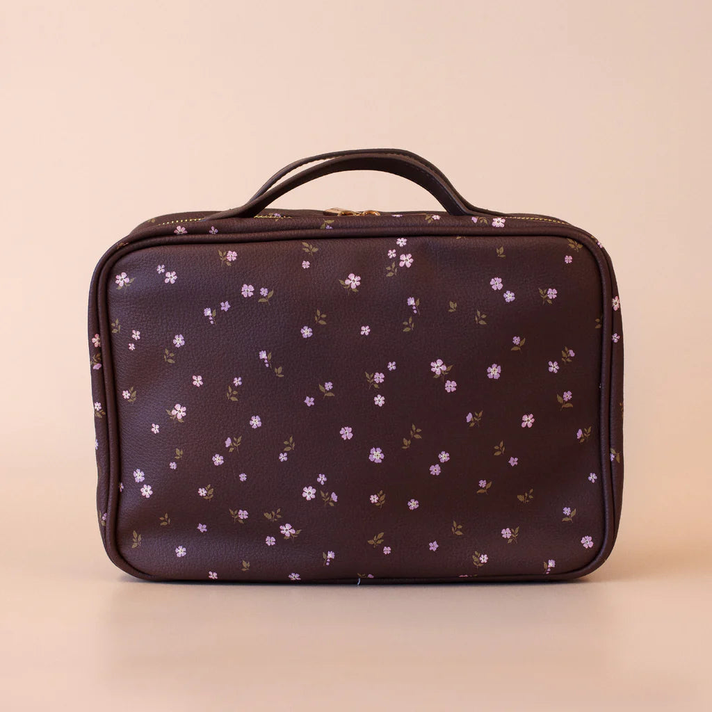 Small cosmetic bag with floral pattern on a beige background