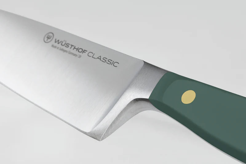 Wüsthof Classic knife with a green handle on a white background