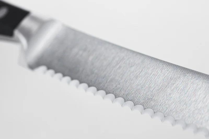 Close-up of a knife blade on a white background