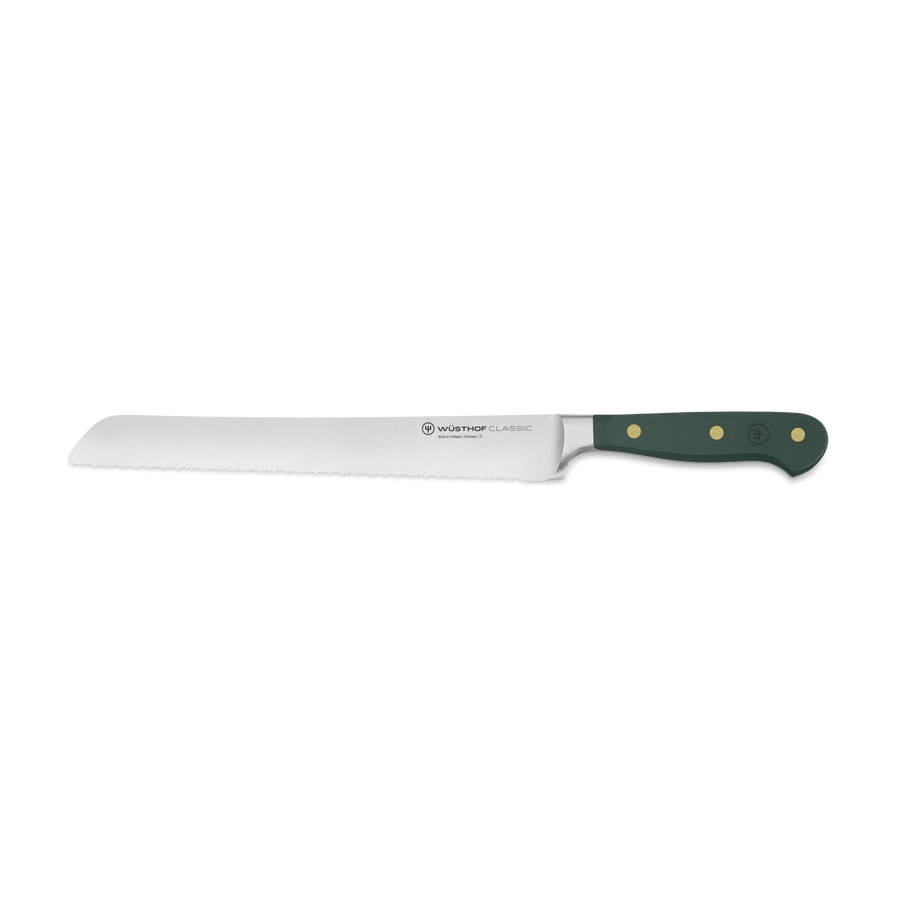 Wusthof bread knife with green handle on a white background