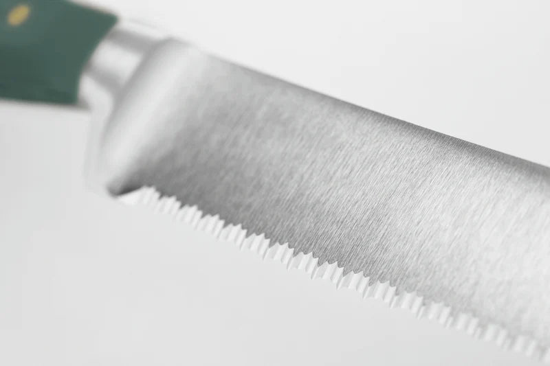 Close-up of a knife blade on a white background