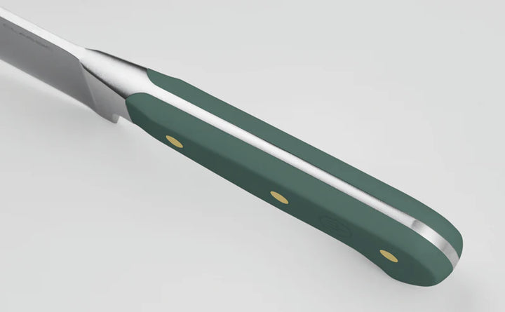 Knife with a green handle on a light gray background