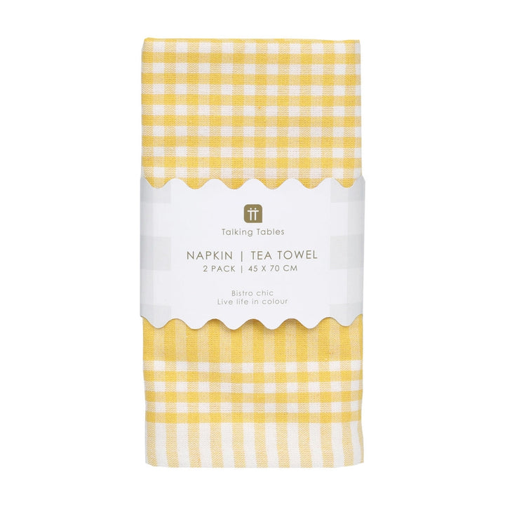 Pack of yellow checkered napkins and tea towel with a white label on a white background