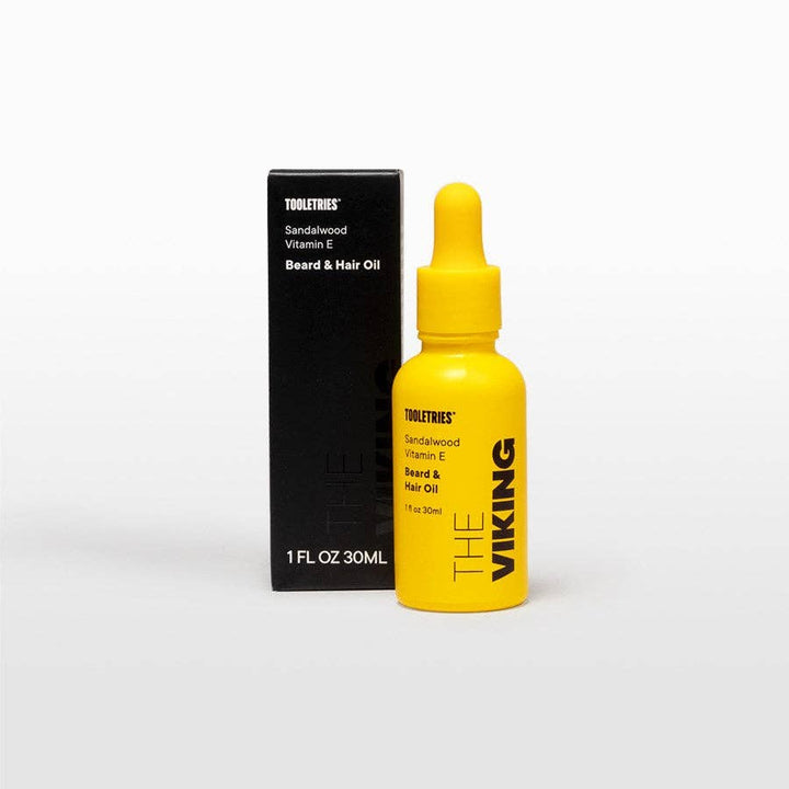 The Viking beard and hair oil with packaging on a white background