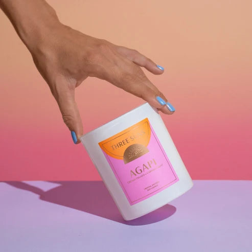 Hand holding a product with &