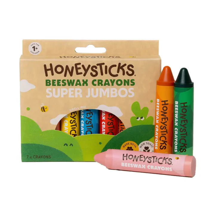 A box of Honeysticks Beeswax Jumbo Crayons with a pink, orange and green crayon in front on a white background