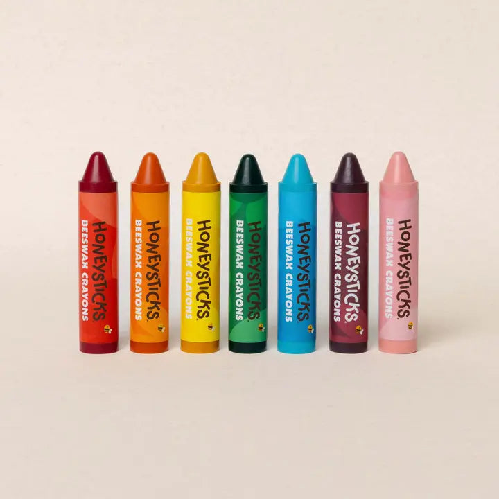 7 beeswax jumbo crayons in red, orange, yellow, green. blue, purple & pink on a whtie background