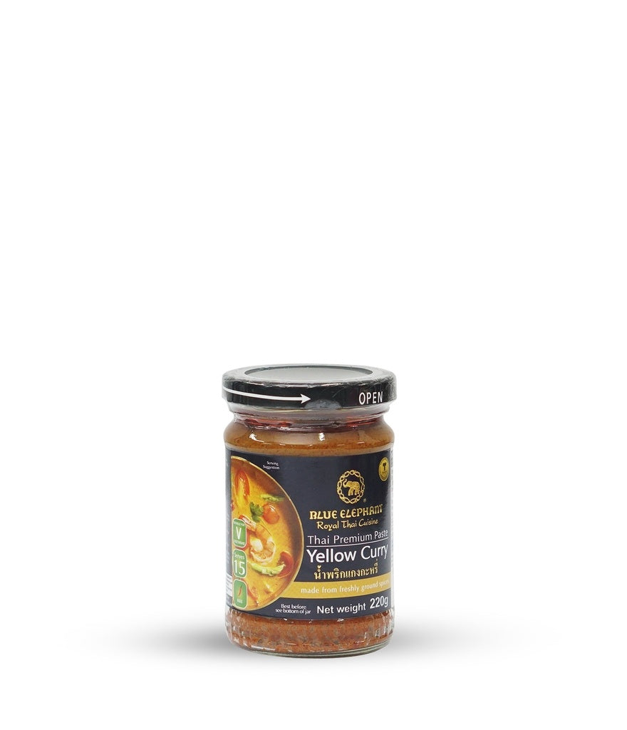 A jar of Blue Elephant thai yellow curry paste on a white background