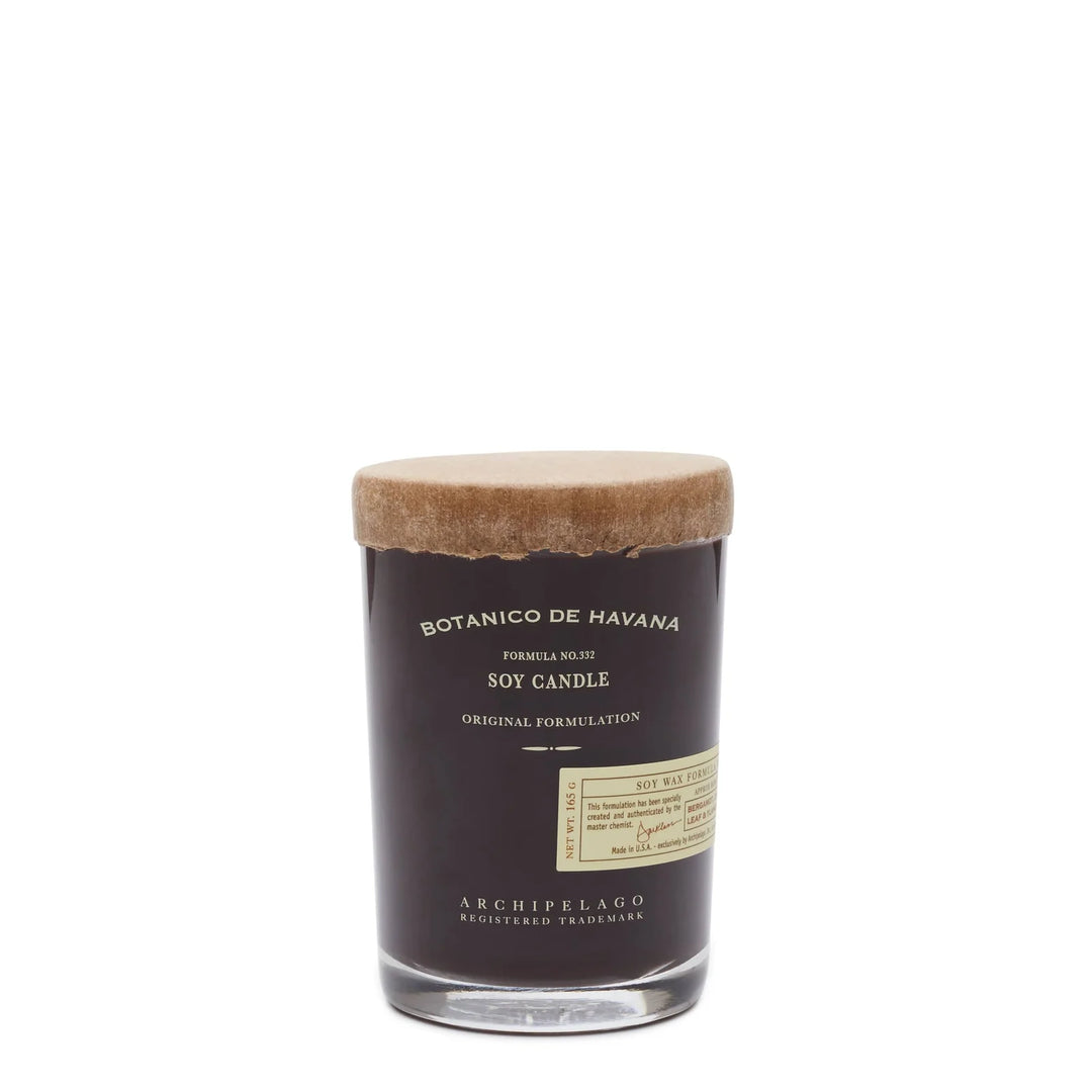 Soy candle with a brown lid and label on a white background