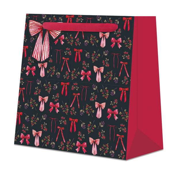 Large black and red gift bag with Christmas bow design on white background.