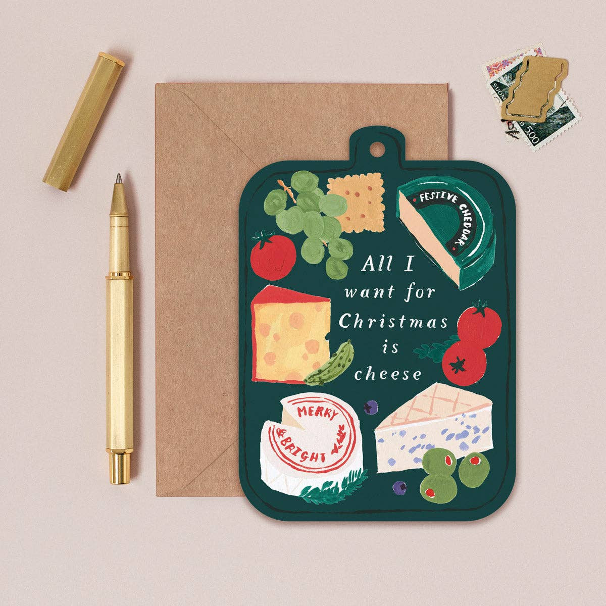 Card with cheese-themed illustration and envelope on a beige background
