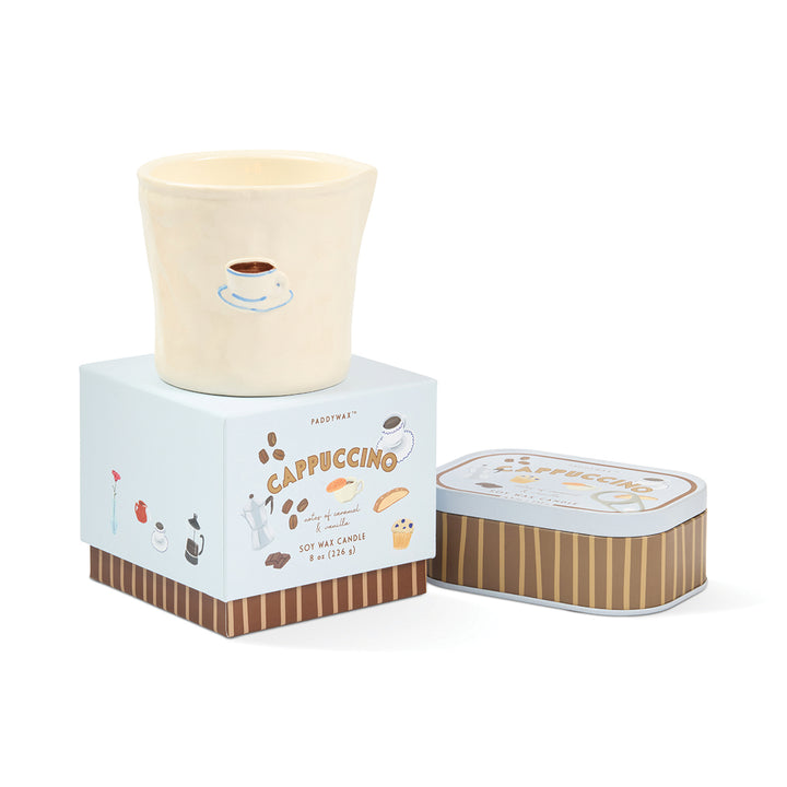 Candle with packaging labeled &