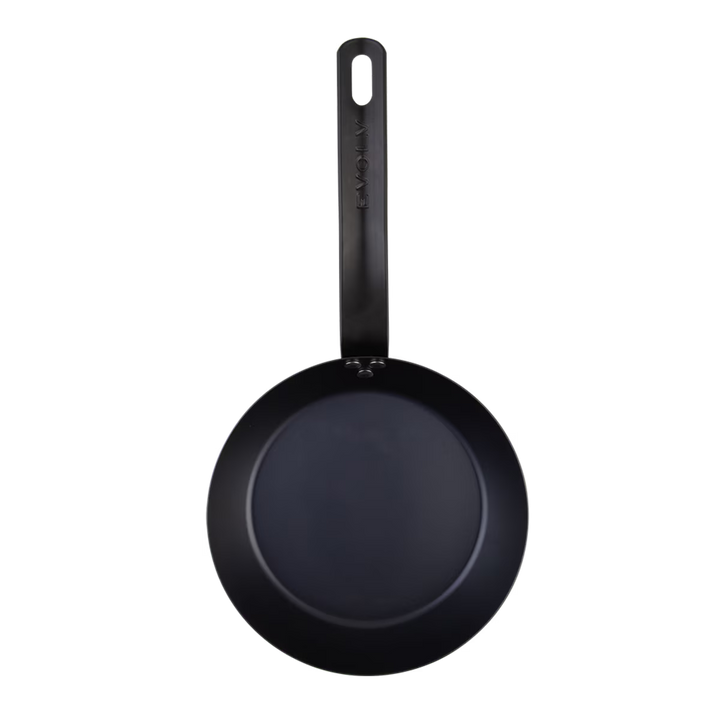 Black frying pan with a handle on a white background