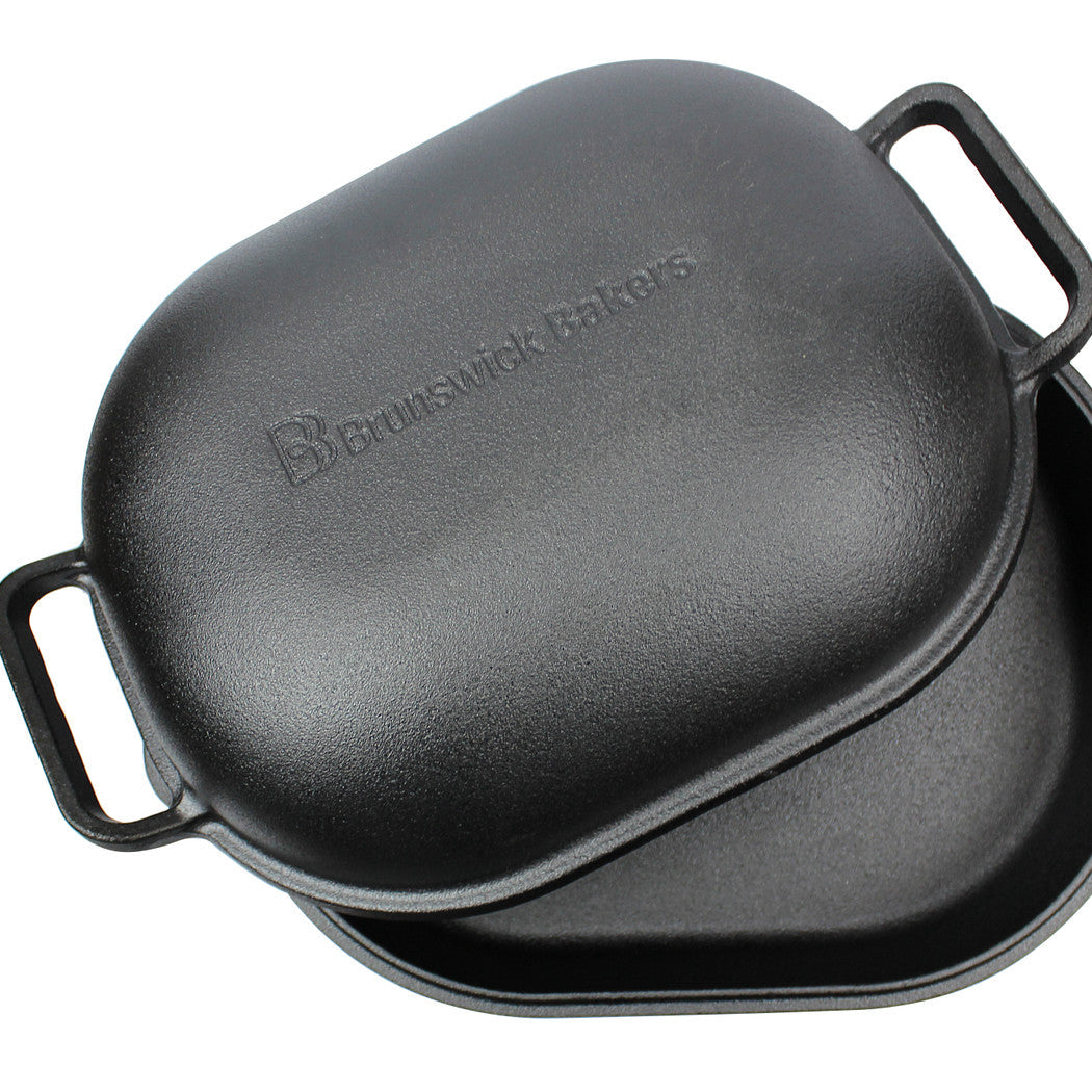 Black cast iron baking pan with 'Brownswick Bakers' branding on a white background