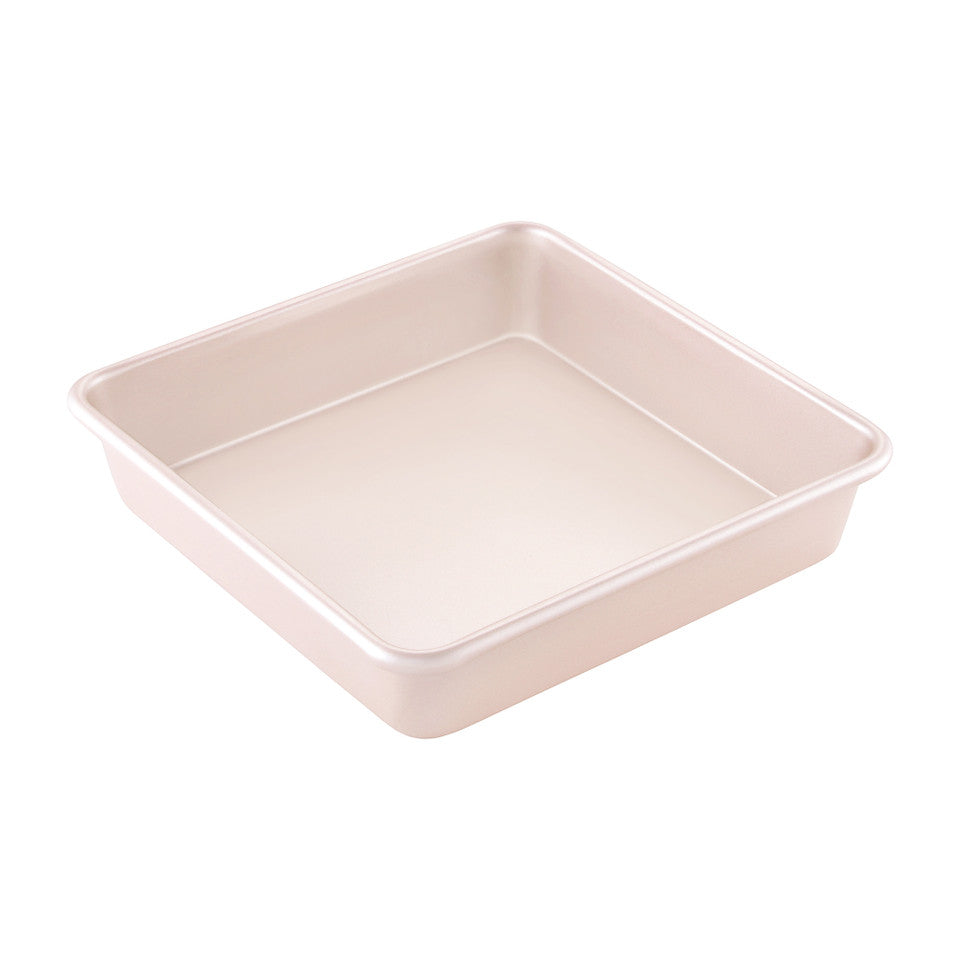 Pink square baking tin on a white background