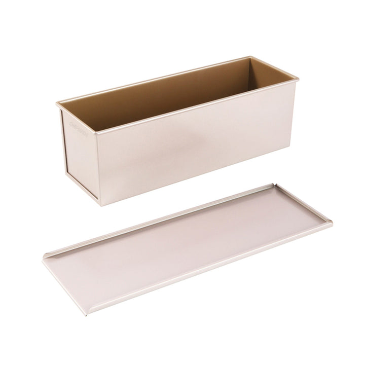 Metal loaf pan with a lid on a white background