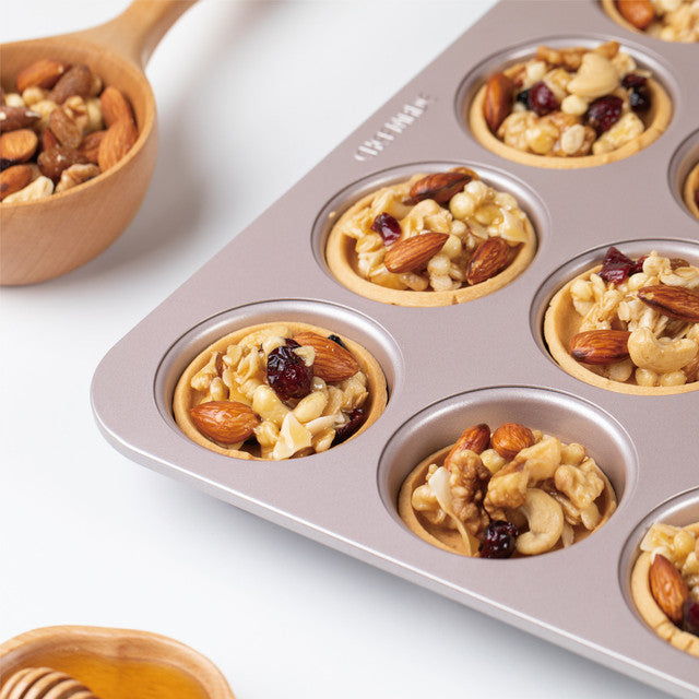 Nutty tarts in a muffin tray