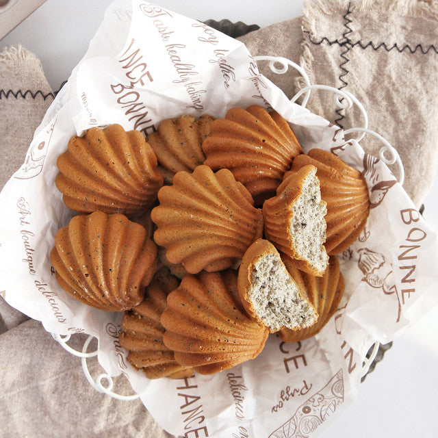 Baked goods in a decorative basket with 'Bonne' branding on the paper.