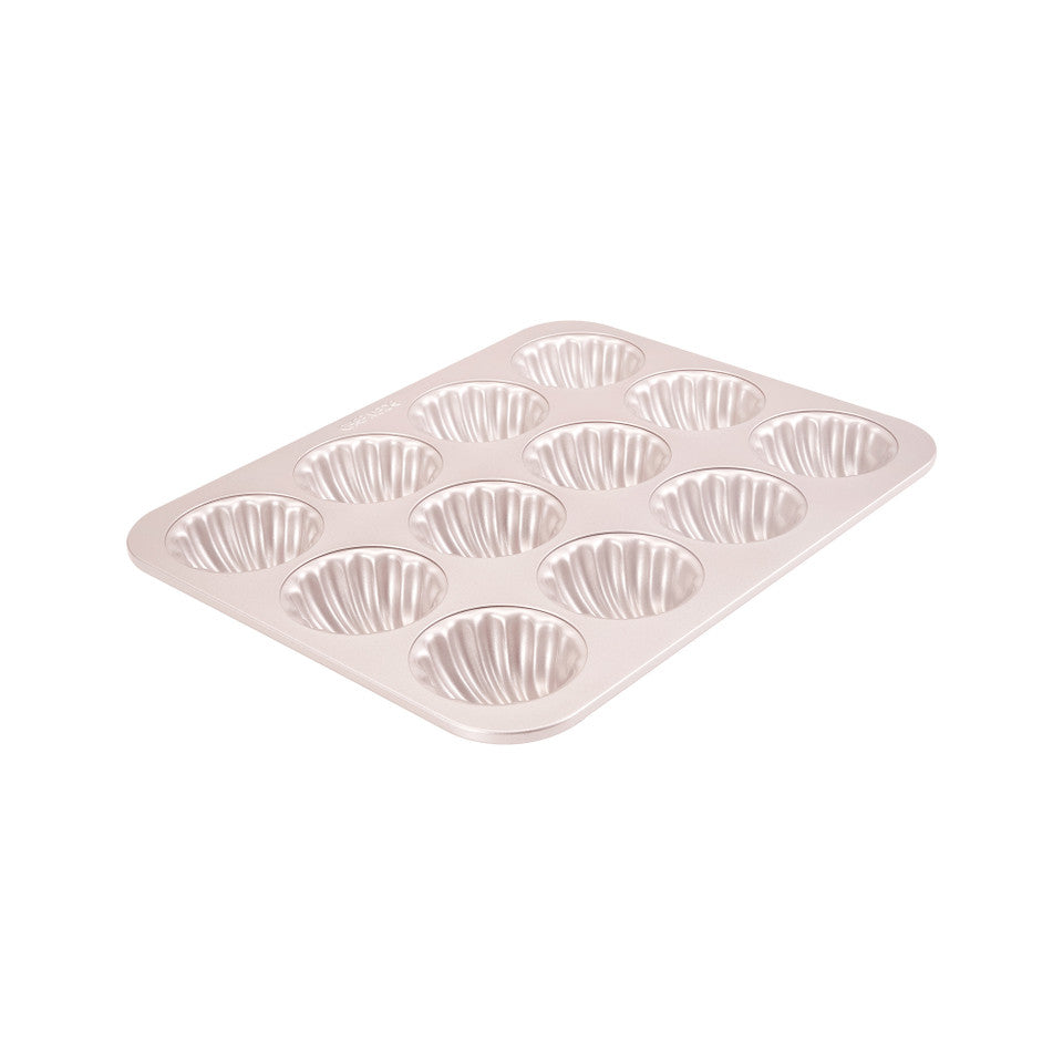 Metal muffin tin with multiple compartments on a white background