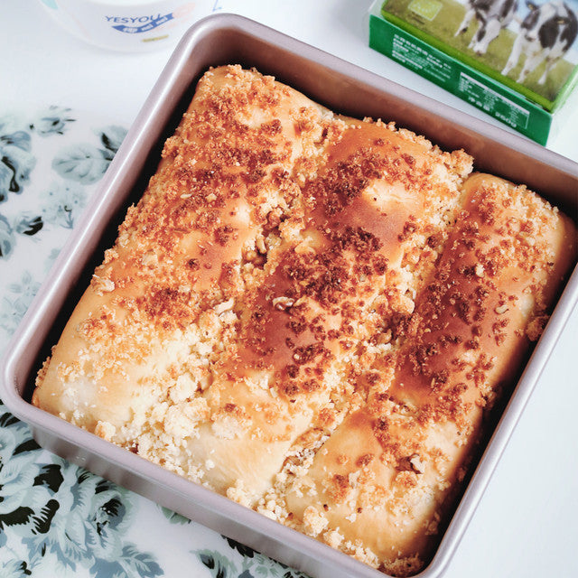 Baked dish in a pan with a box of milk in the background