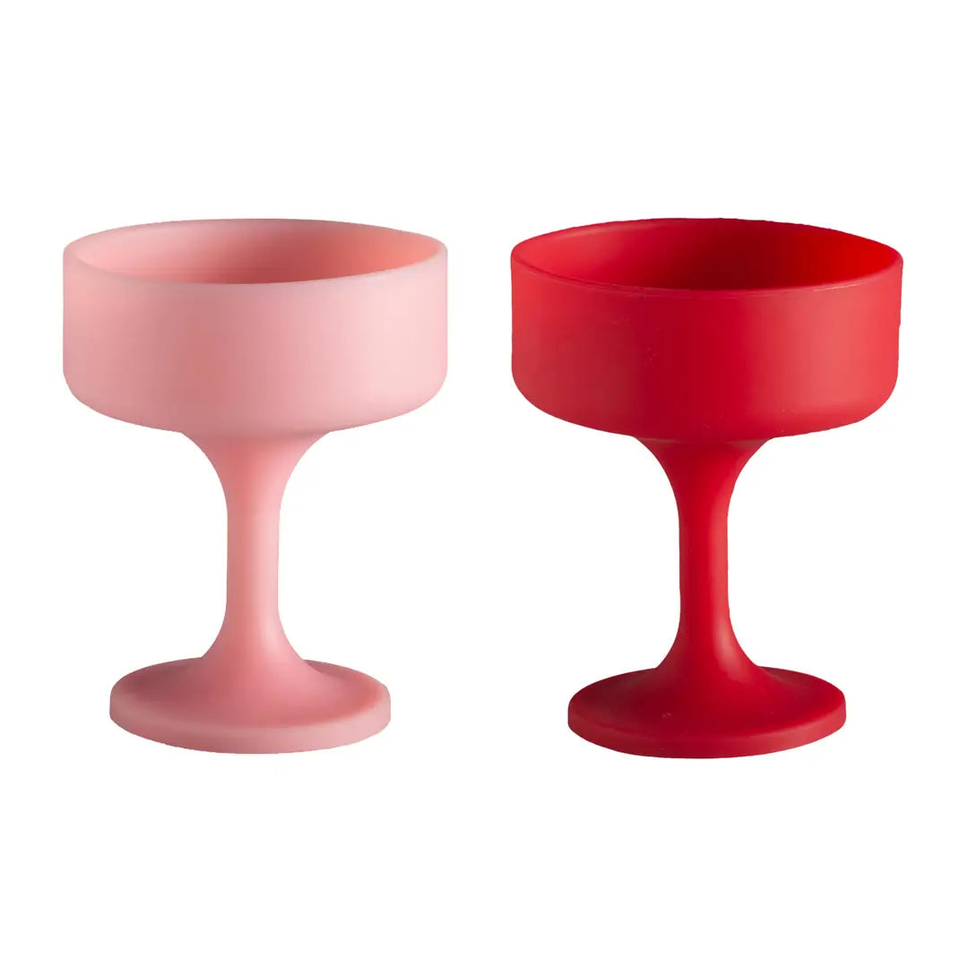 Two pink and red silicone wine glasses on a white background