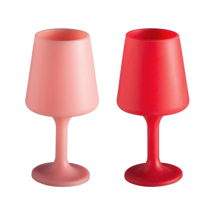 Two pink and red silicone wine glasses on a white background