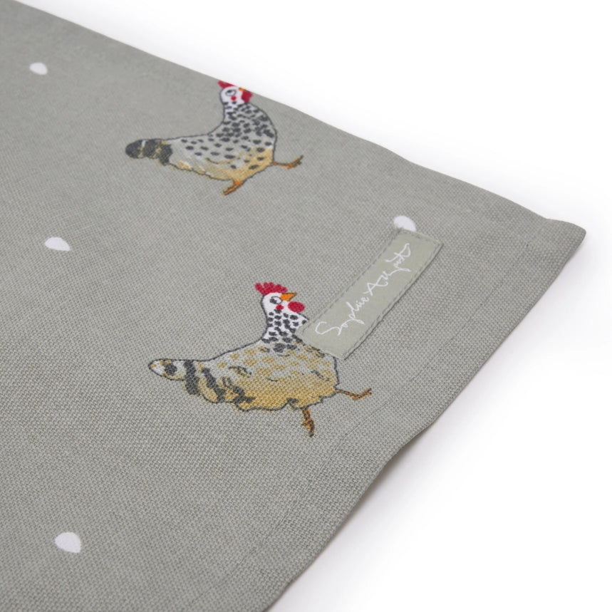 A gray kitchen tea towel featuring a repeating pattern of chickens and small white dots, shown flat against a white background.