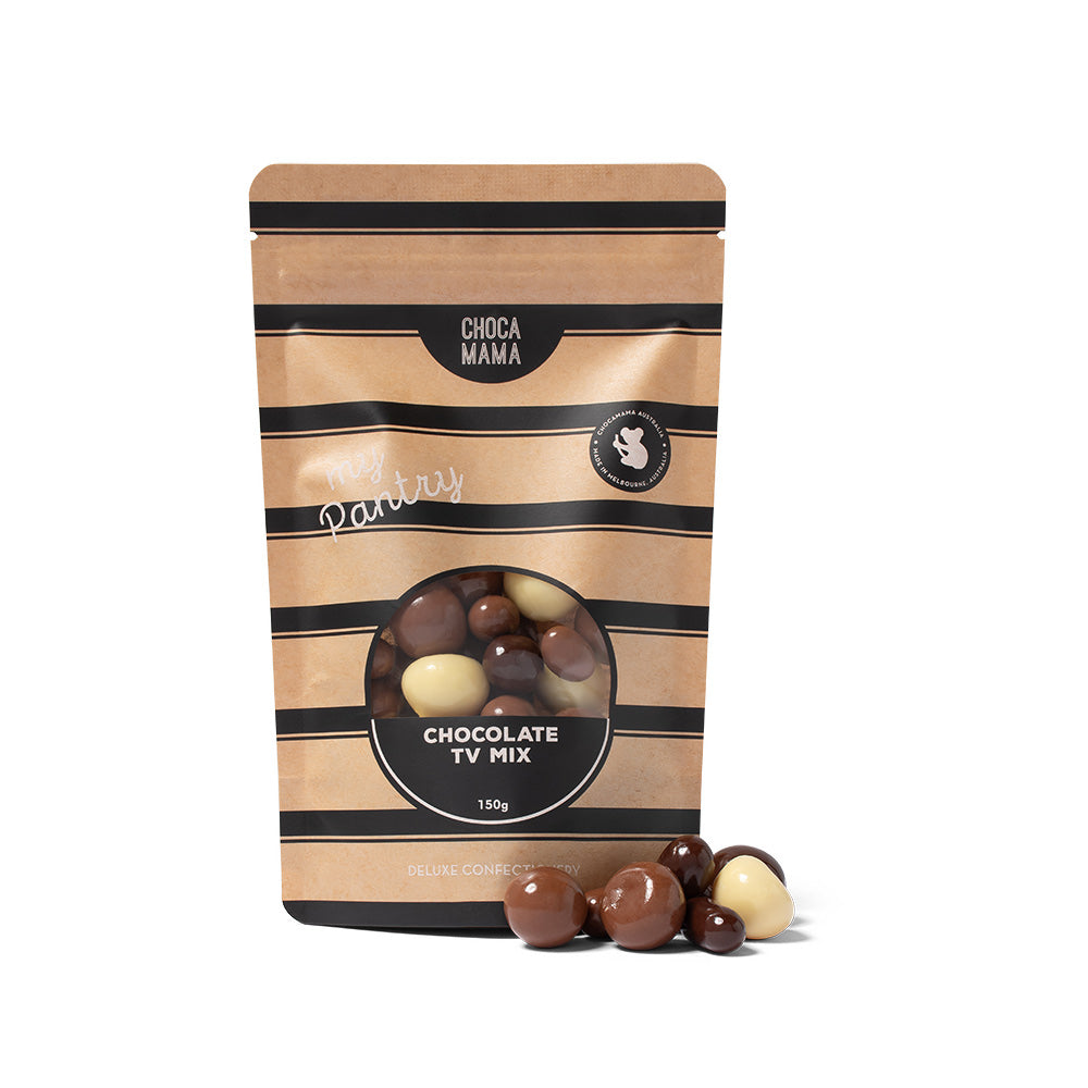 A stand-up pouch of Choca Mama Chocolate TV Mix, featuring a kraft brown and black striped design with a clear window showing the chocolate mix inside. Several chocolate pieces are placed in front of the pouch on a clean white background.