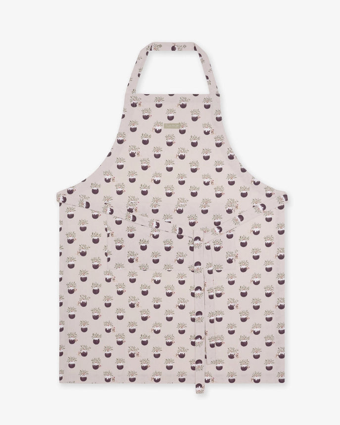Fabric apron with a repeating Christmas puddings pattern