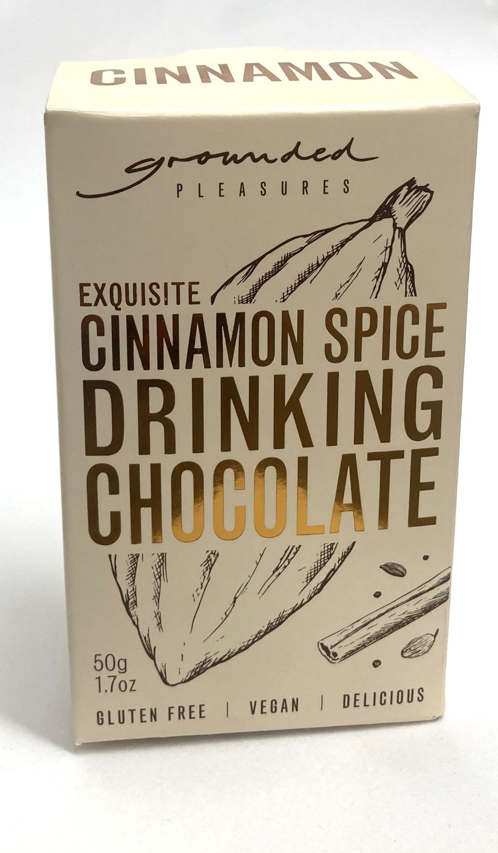 A box of Grounded Pleasures cinnamon spice drinking chocolate on a white background