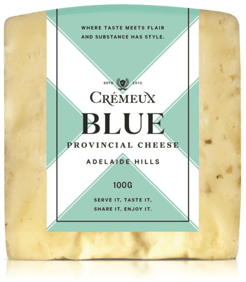 Block of Crèmeux Blue Provincial Cheese with a green label on a white background