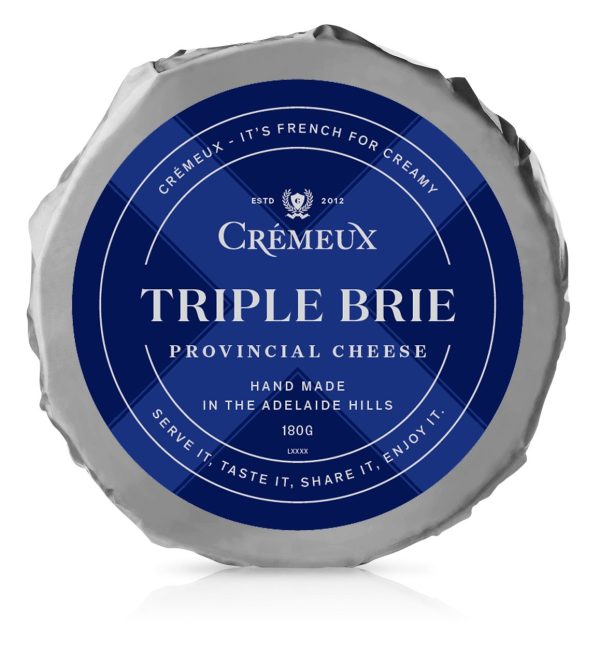 Wheel of brie cheese on white background
