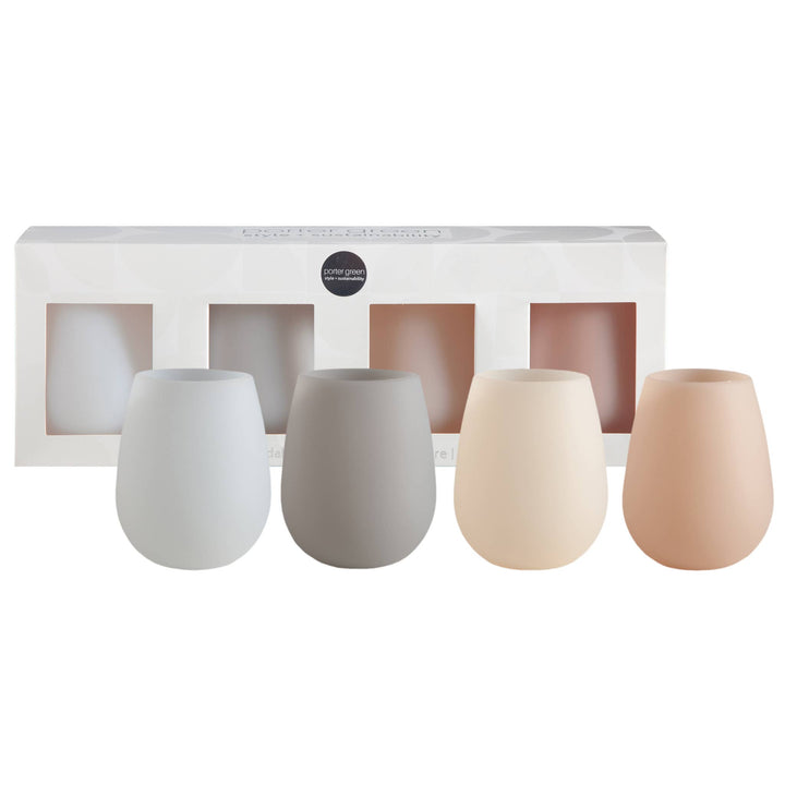 Set of four silicone tumblers in different colors with a packaging box in the background.
