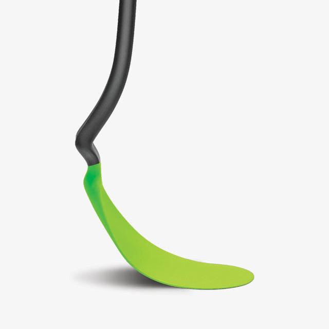 Green and black spatula on a white background