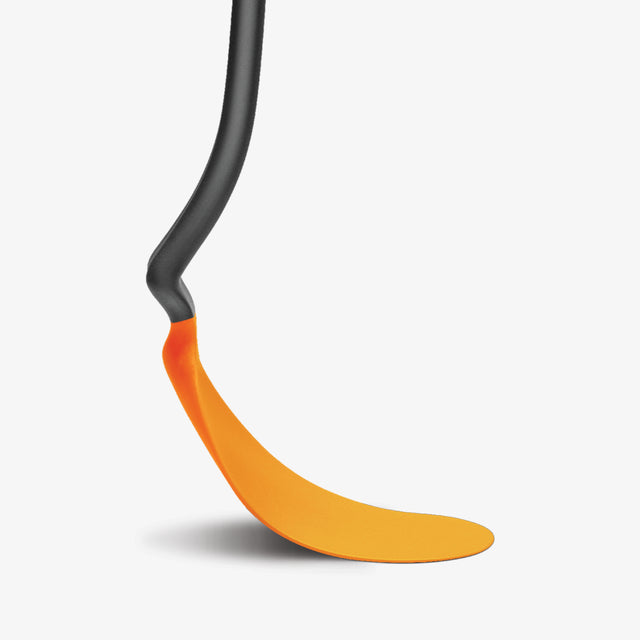 Orange and black spatula on a white background