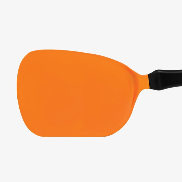 Orange spatula with a black handle on a white background