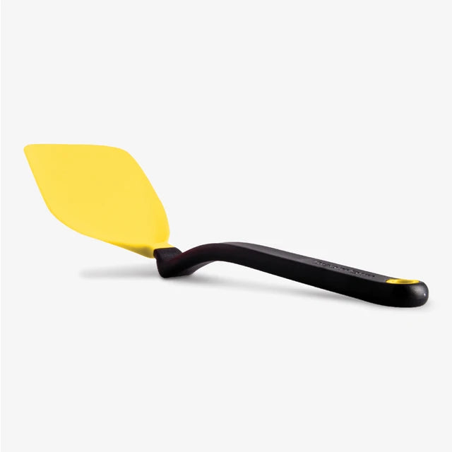 Yellow spatula with black handle on a white background