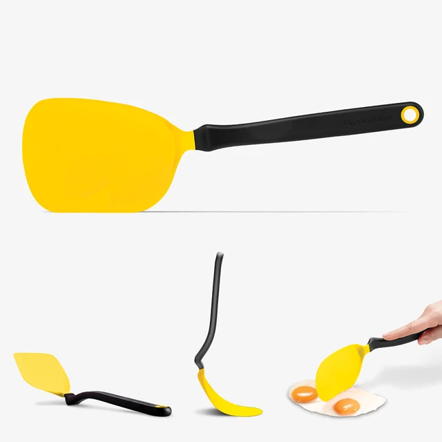 Yellow spatula with black handle on a white background